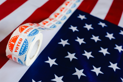 American Flag with roll of I Voted Today stickers VOPlanet Political Voice Talent