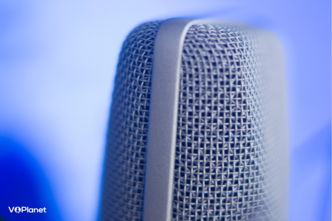 Voice Over Genres Close up of a microphone on a blue background Voice Over Genres