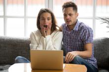 What to Write in Your Voice Over Audition Proposal Two voice actors looking baffled and surprised at laptop