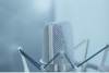 Why Each Voice Over Audition is Valuable Close up of the top of a silver voice over microphone in a shock mount